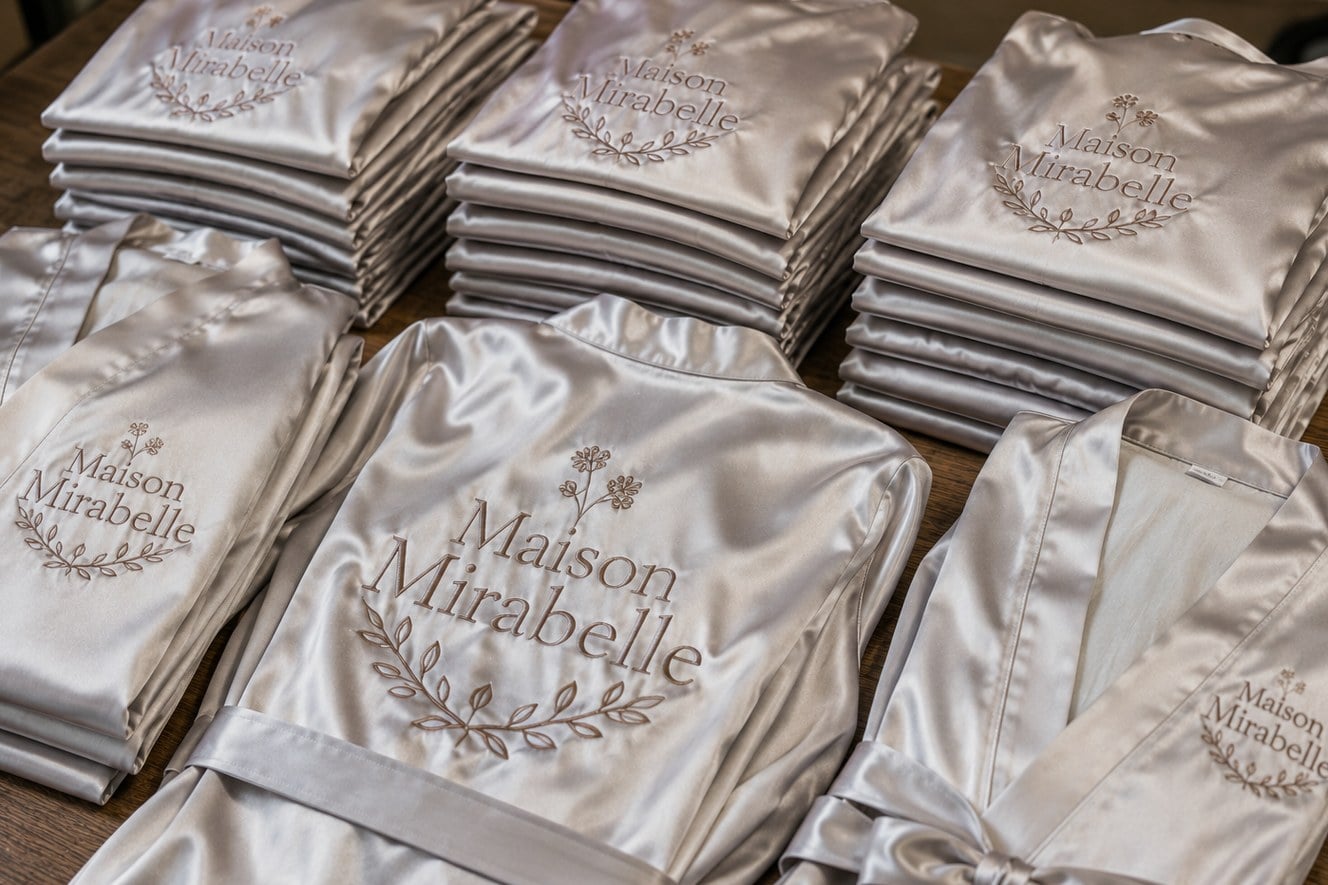 Custom kimono robes with monograms laid out before an event